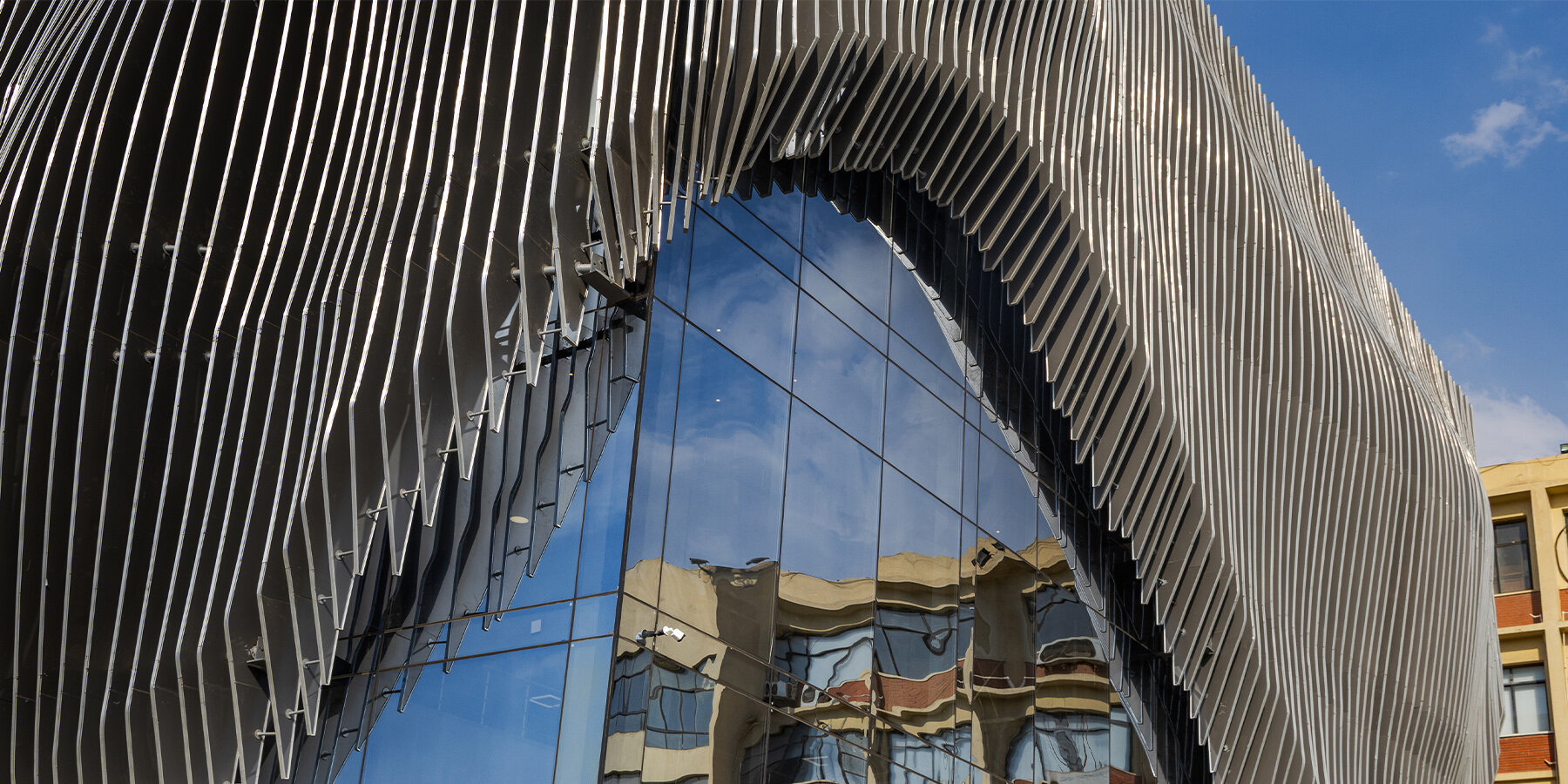 The facade design draws from the metaphor of a theater curtain | photo by Elmaghraby Design House
